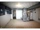Functional basement with utilities, storage cabinets, and laundry area in the background at 1739 Forest Dr, Indianapolis, IN 46227
