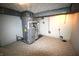 Spacious basement with mechanicals, painted walls, and durable tiled flooring throughout at 1739 Forest Dr, Indianapolis, IN 46227