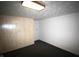 View of a finished basement featuring painted walls, neutral carpet, and a door at 1739 Forest Dr, Indianapolis, IN 46227