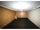 Spacious basement area with vinyl flooring and paneled walls at 1739 Forest Dr, Indianapolis, IN 46227