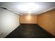Large basement area featuring painted walls and floor with paneled accent walls at 1739 Forest Dr, Indianapolis, IN 46227