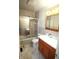Cozy bathroom showcasing a bathtub with glass doors, vanity, and tile flooring for a relaxing experience at 1739 Forest Dr, Indianapolis, IN 46227