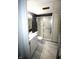 Bathroom featuring a single vanity, toilet and updated shower at 1739 Forest Dr, Indianapolis, IN 46227