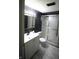 Updated bathroom featuring an updated vanity, toilet, and shower at 1739 Forest Dr, Indianapolis, IN 46227