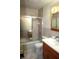 Updated bathroom with a tub-shower, vanity, and tile flooring that offers both style and functionality at 1739 Forest Dr, Indianapolis, IN 46227