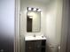 Bathroom featuring a modern vanity with a mirror and a convenient toilet and shower setup at 1739 Forest Dr, Indianapolis, IN 46227