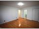 Spacious bedroom with gleaming hardwood floors and ensuite bathroom access at 1739 Forest Dr, Indianapolis, IN 46227