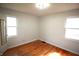Inviting bedroom with gleaming hardwood floors, natural light from windows, and neutral-toned walls at 1739 Forest Dr, Indianapolis, IN 46227