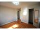 Spacious bedroom with hardwood floors, natural light, and a closet, providing ample storage at 1739 Forest Dr, Indianapolis, IN 46227