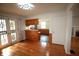 Open-concept dining area with hardwood floors, seamlessly connecting to the adjacent rooms for modern living at 1739 Forest Dr, Indianapolis, IN 46227