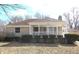 Inviting exterior of a well-maintained single-story home with a covered front porch and manicured hedges at 1739 Forest Dr, Indianapolis, IN 46227