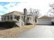 Lovely single-story home with detached garage, and inviting covered front porch, perfect for relaxing outdoors at 1739 Forest Dr, Indianapolis, IN 46227