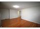 Expansive living room showcasing beautiful hardwood floors and a neutral color palette at 1739 Forest Dr, Indianapolis, IN 46227