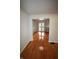 Open-concept living room with hardwood flooring, and a view into the dining area at 1739 Forest Dr, Indianapolis, IN 46227