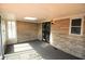 Inviting sunroom with stone wall, skylight, and decorative front door at 1739 Forest Dr, Indianapolis, IN 46227