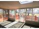 Sunroom featuring sliding glass doors leading to an outdoor deck and views of the backyard at 1739 Forest Dr, Indianapolis, IN 46227