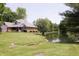 Backyard view of a home with a pond and mature trees surrounding the property at 1739 S County Road 450 E, Avon, IN 46123