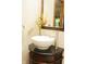 Charming bathroom vanity with decorative flowers, bowl sink, and brushed nickel faucet at 1739 S County Road 450 E, Avon, IN 46123