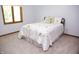 Bedroom featuring soft carpet and a bed with white comforter and decorative pillows at 1739 S County Road 450 E, Avon, IN 46123