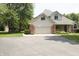Two story home featuring a brick and vinyl exterior, two car garage, and front porch at 1739 S County Road 450 E, Avon, IN 46123