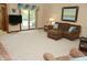 Open concept living room with carpet, picture window, and sliding glass door to the outdoors at 1739 S County Road 450 E, Avon, IN 46123
