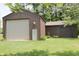 Exterior of garage features doors, star decoration, and manicured landscaping at 1739 S County Road 450 E, Avon, IN 46123