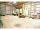 Spacious garage interior with high ceilings, storage, and work vehicles at 1739 S County Road 450 E, Avon, IN 46123