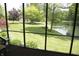 Relaxing screened porch with peaceful views of the verdant yard and pond at 1739 S County Road 450 E, Avon, IN 46123