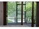 Exterior view from a bedroom of a serene lake scene with lush trees at 1739 S County Road 450 E, Avon, IN 46123