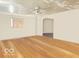 Open concept room with hardwood flooring, neutral walls and a ceiling fan at 196 Bakemeyer St, Indianapolis, IN 46225
