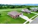 Aerial view of a beautiful home on a lush lot backing to a golf course and pond at 217 Saint Andrews Ave, Edinburgh, IN 46124