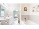 Bathroom features a double vanity, bathtub, and view into the main bedroom at 217 Saint Andrews Ave, Edinburgh, IN 46124