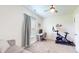 Bedroom with work station, exercise bike, and ample natural light at 217 Saint Andrews Ave, Edinburgh, IN 46124