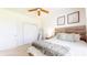 Cozy bedroom showcasing a wooden headboard bed with soft linens, neutral colors, and a mirror in the corner at 217 Saint Andrews Ave, Edinburgh, IN 46124