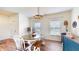 Inviting dining area with a wooden table, bench, and charming decor for Gathering gatherings at 217 Saint Andrews Ave, Edinburgh, IN 46124