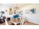 Bright dining room with a wooden table, stylish decor, and a view to the kitchen at 217 Saint Andrews Ave, Edinburgh, IN 46124