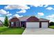 Well-maintained brick home with a two-car garage, manicured lawn, and beautiful curb appeal at 217 Saint Andrews Ave, Edinburgh, IN 46124