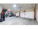 Spacious three car garage featuring ample storage, high ceilings, and finished walls at 217 Saint Andrews Ave, Edinburgh, IN 46124