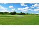 Expansive golf course view with lush green grass and clear blue sky at 217 Saint Andrews Ave, Edinburgh, IN 46124