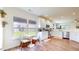 Charming kitchen eating nook with white cabinets, natural light, and a view to the outdoors at 217 Saint Andrews Ave, Edinburgh, IN 46124