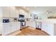 Modern kitchen with white cabinets, stainless steel appliances, and a spacious countertop at 217 Saint Andrews Ave, Edinburgh, IN 46124