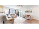 Open concept living room with plush seating, natural light and sliding door to outdoor patio at 217 Saint Andrews Ave, Edinburgh, IN 46124