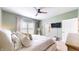 Cozy main bedroom featuring a ceiling fan, neutral paint, and lots of natural light at 217 Saint Andrews Ave, Edinburgh, IN 46124