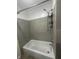 Close up of tiled shower-tub combination with shower head at 2180 N Irwin St, Indianapolis, IN 46219