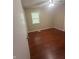 Cozy bedroom with hardwood flooring, neutral walls, and a ceiling fan for added comfort at 2180 N Irwin St, Indianapolis, IN 46219
