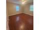 Bedroom with neutral walls, hardwood floors, and good natural light at 2180 N Irwin St, Indianapolis, IN 46219