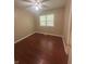 Neutral bedroom with hardwood floors and window at 2180 N Irwin St, Indianapolis, IN 46219