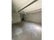 Uncluttered garage with concrete flooring, offering ample space for parking and storage solutions at 2180 N Irwin St, Indianapolis, IN 46219