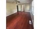 Inviting living room with hardwood floors, neutral paint and views into adjacent rooms at 2180 N Irwin St, Indianapolis, IN 46219