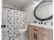Charming bathroom with Mickey Mouse-themed shower curtain, vanity, and stylish black fixtures at 2580 Bluewood Way, Plainfield, IN 46168